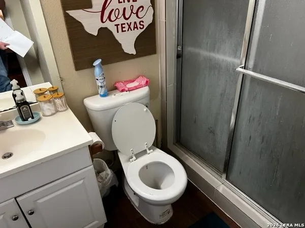 a bathroom with a toilet and a sink