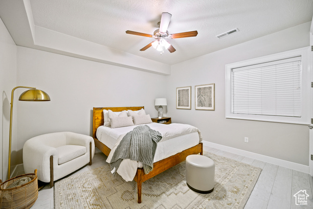 6026 Zen Trail Way St. George, UT 84790 - Photo 26 of 41 Bedroom with ceiling fan and a textured ceiling