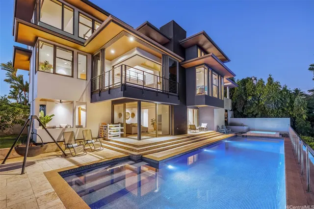 a front view of house with pool table and chairs