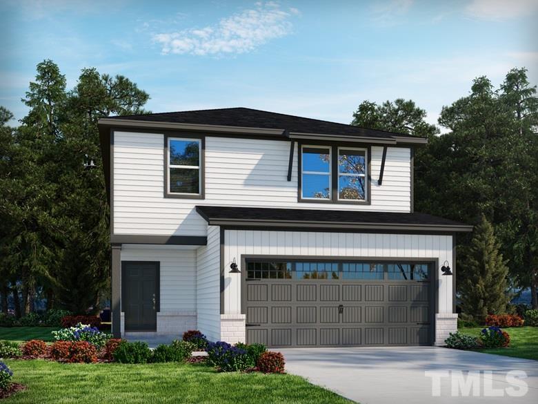 313 Diversity Way Raleigh, NC 27610 - Photo 1 of 3 a front view of a house with a garden