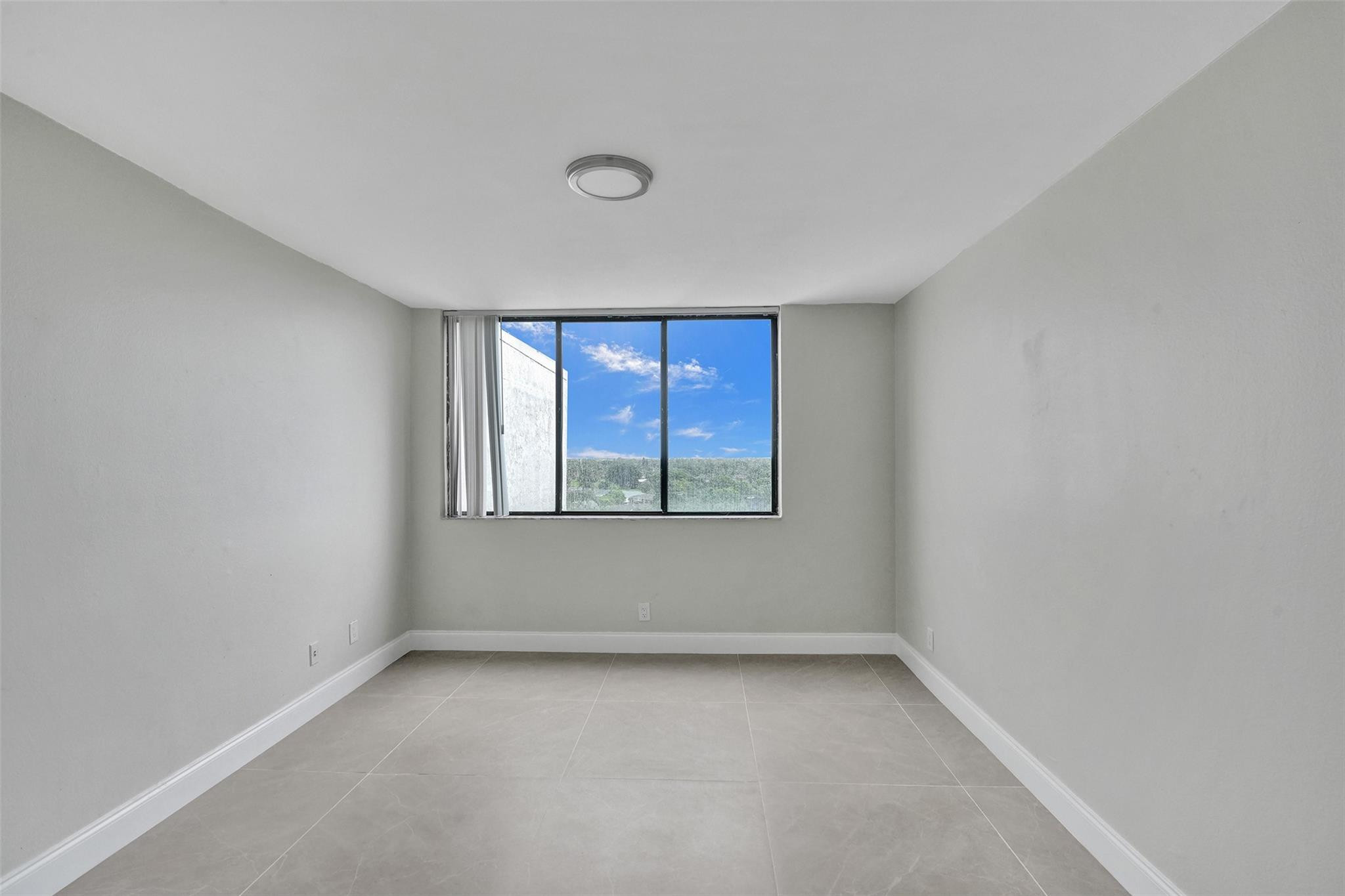 4222 Inverrary Boulevard, Unit 4810 Lauderhill, FL 33319 - Photo 31 of 63 a view of an empty room with a window
