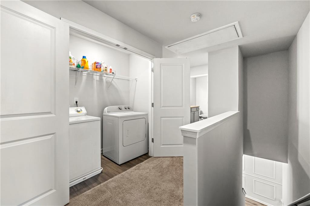 7492 Knoll Hollow Road Lithonia, GA 30058 - Photo 21 of 30 a view of storage and utility room with washer and dryer