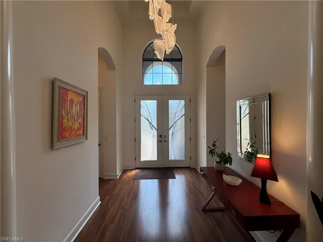 a dining room with furniture window and wooden floor