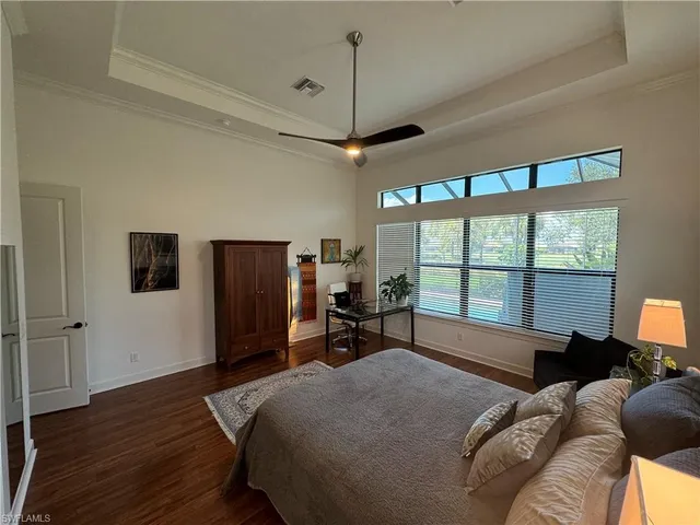 a bed room with a bed and a chair