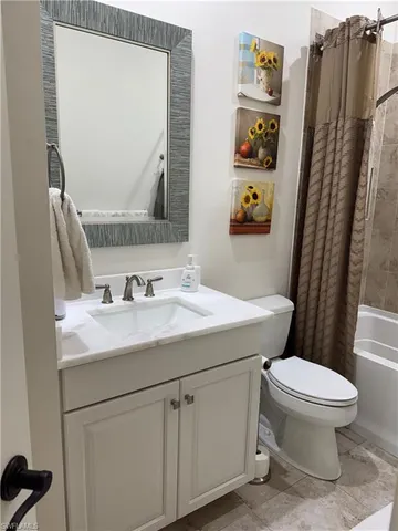 a bathroom with a sink toilet and vanity