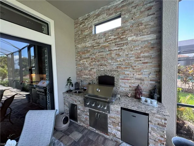 a kitchen with a stove and a fireplace