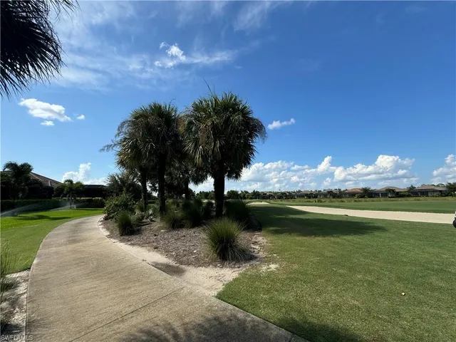 a view of a lake with a house in the background
