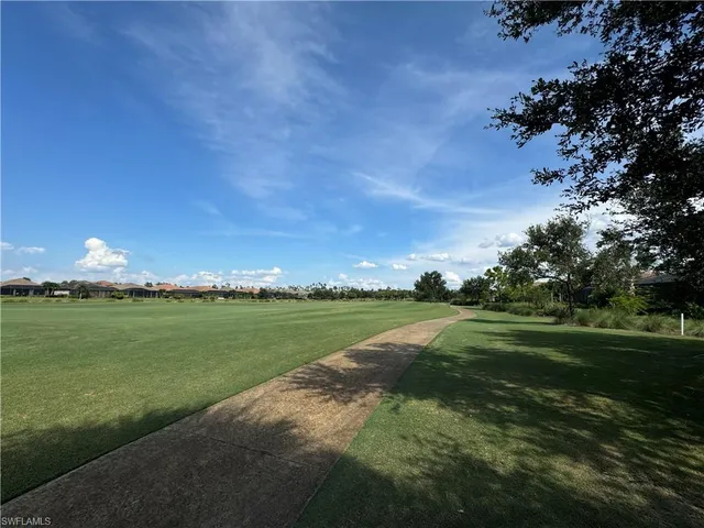 a view of a golf course with a lake