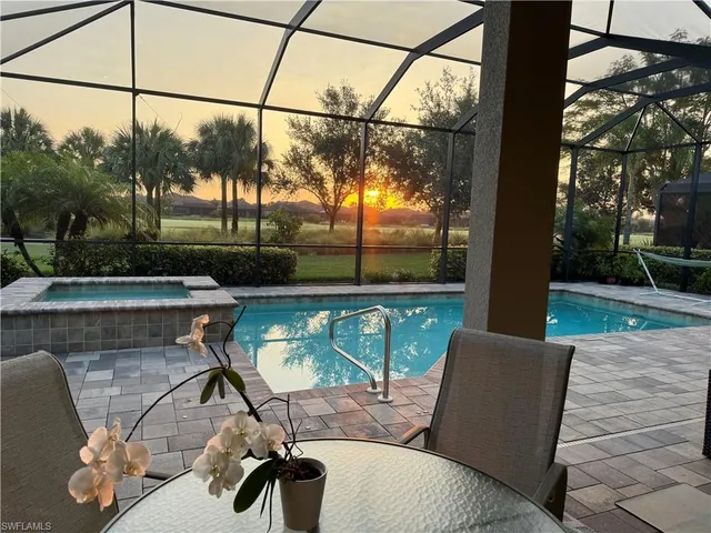 a view of a patio with table and chairs potted plants with wooden floor