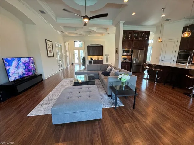 a living room with furniture fireplace and flat screen tv