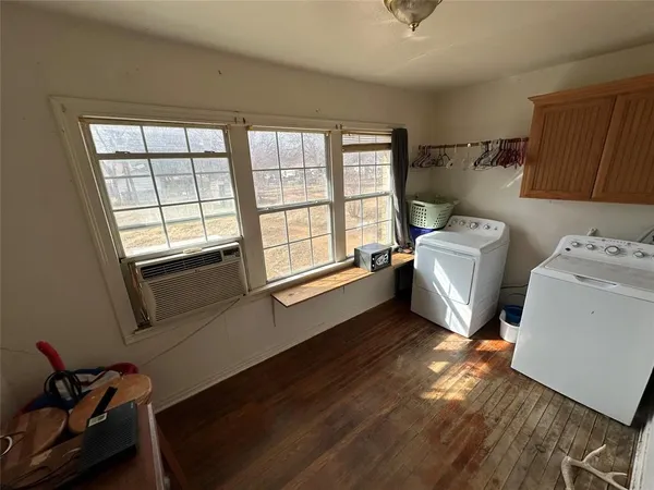 a kitchen with granite countertop a stove a sink and a microwave