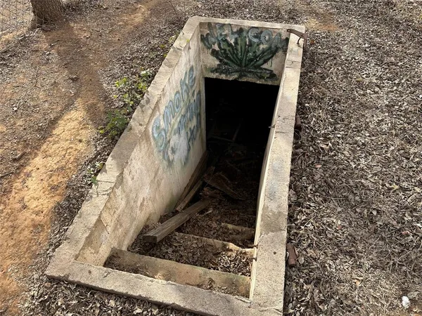 a kitchen with a refrigerator and a stove top oven