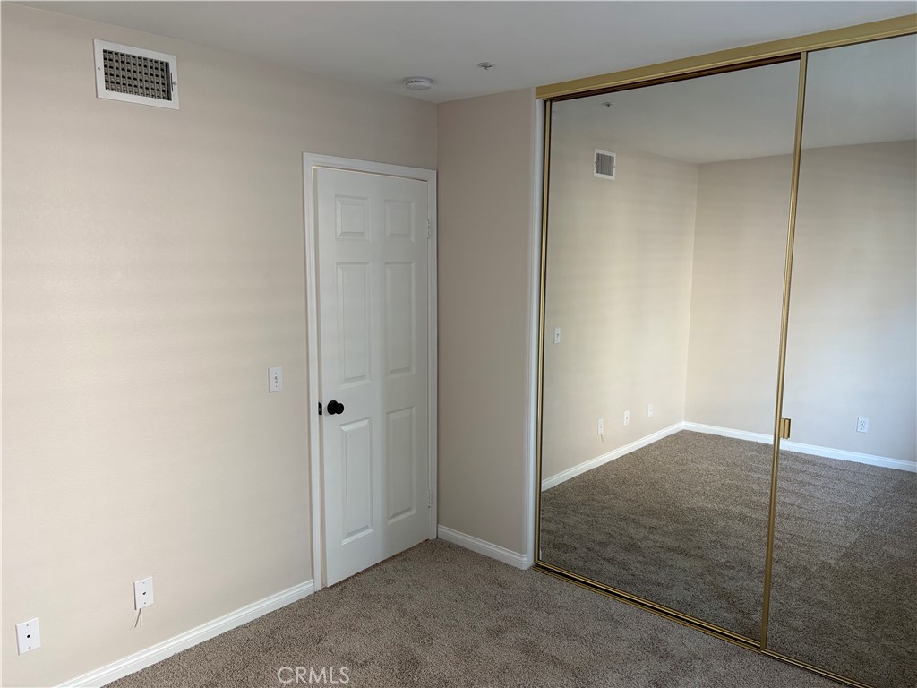 28999 Clear Spring Lane Highland, CA 92346 - Photo 16 of 32 Bedroom 2 Mirrored Closet Doors