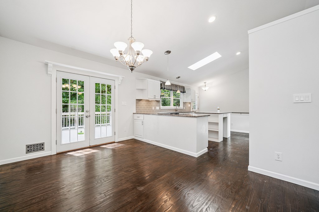 5055 Wright Bridge Road Cumming, GA 30028 - Photo 13 of 39 a view of a kitchen with a dishwasher cabinets and a large window
