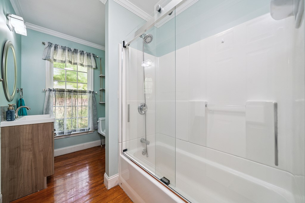 5055 Wright Bridge Road Cumming, GA 30028 - Photo 20 of 39 a bathroom with a tub shower and sink