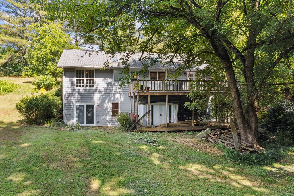 5055 Wright Bridge Road Cumming, GA 30028 - Photo 2 of 39 a front view of a house with a garden