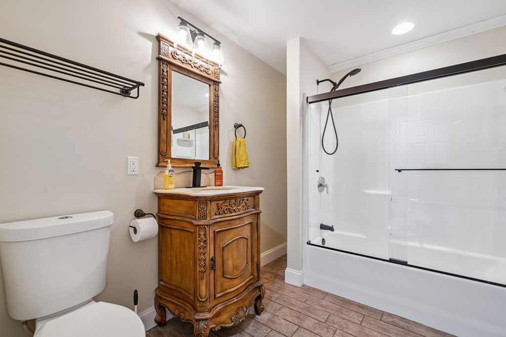 5055 Wright Bridge Road Cumming, GA 30028 - Photo 24 of 39 a bathroom with a sink toilet and shower