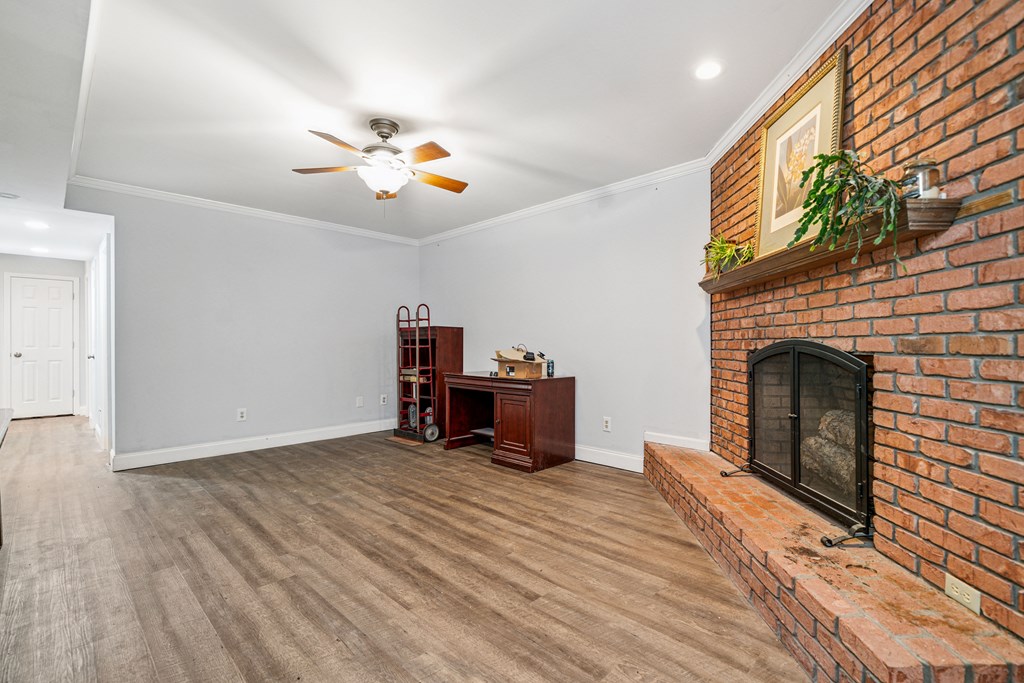 5055 Wright Bridge Road Cumming, GA 30028 - Photo 26 of 39 a view of an empty room with a fireplace and a window