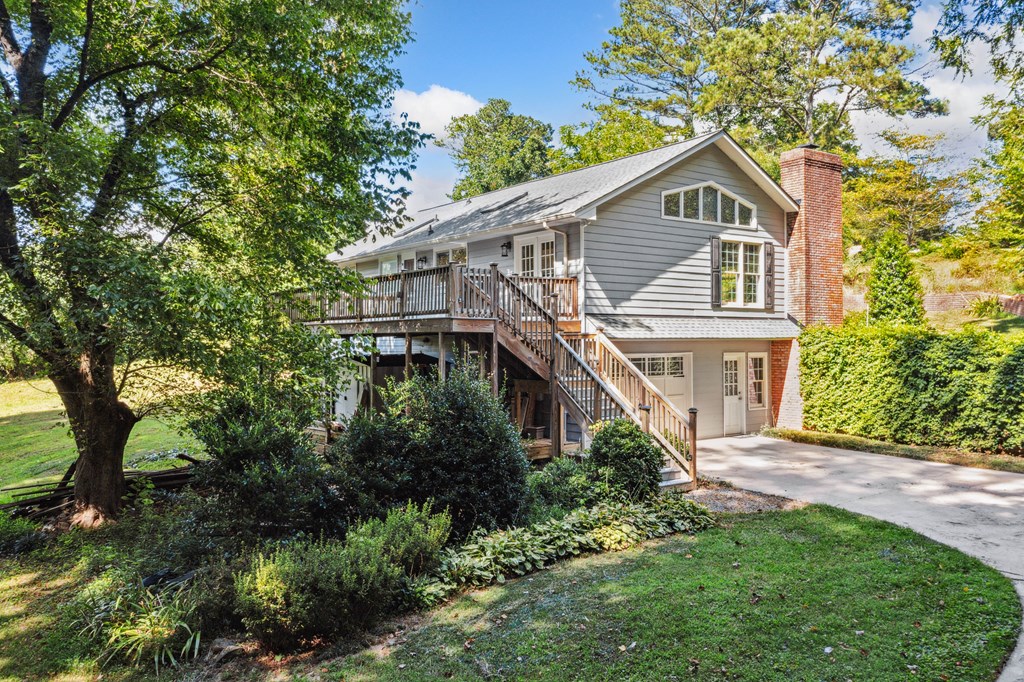 5055 Wright Bridge Road Cumming, GA 30028 - Photo 28 of 39 a front view of a house with a garden