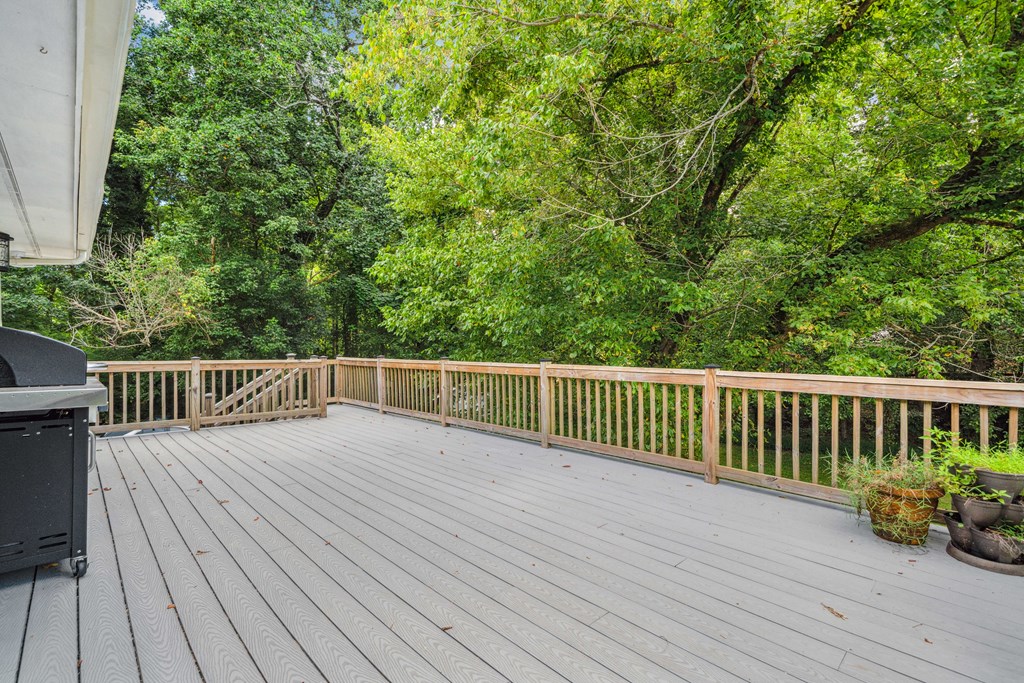 5055 Wright Bridge Road Cumming, GA 30028 - Photo 29 of 39 a balcony with wooden floor and fence