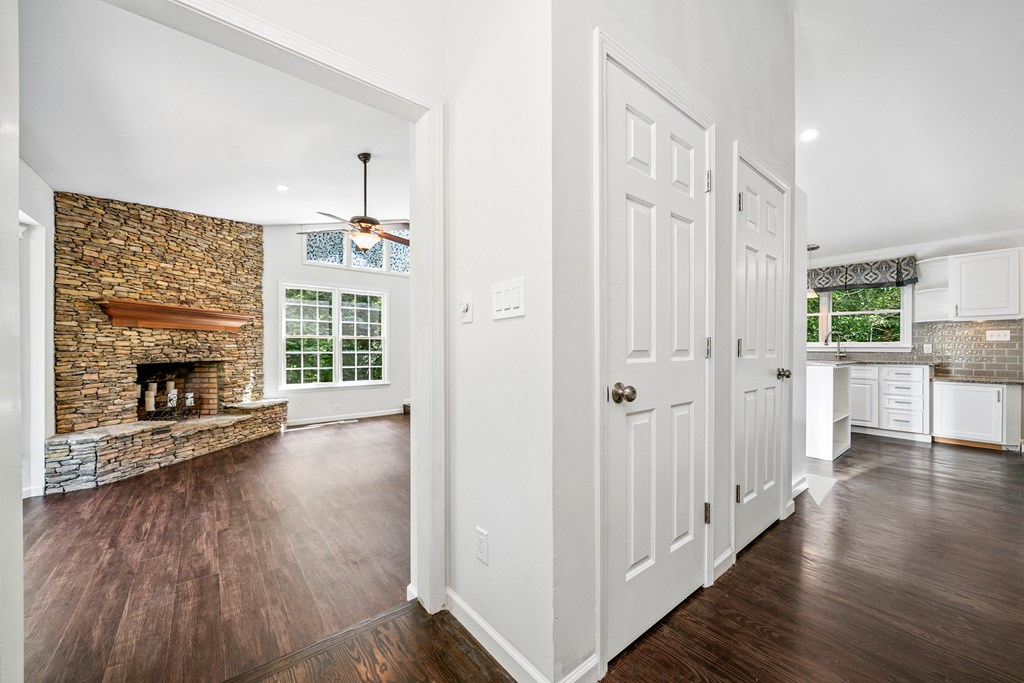 5055 Wright Bridge Road Cumming, GA 30028 - Photo 3 of 39 a view of a livingroom with wooden floor and a fireplace
