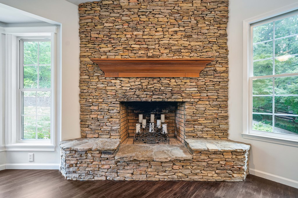 5055 Wright Bridge Road Cumming, GA 30028 - Photo 5 of 39 a living room with furniture and a fireplace