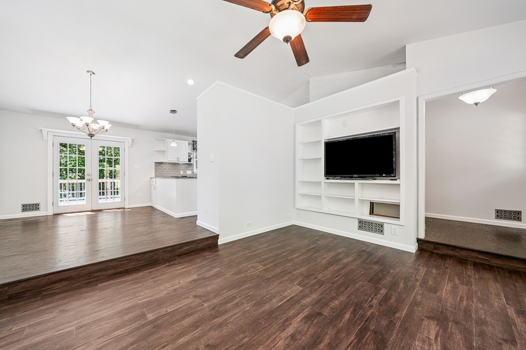 5055 Wright Bridge Road Cumming, GA 30028 - Photo 8 of 39 a view of empty room with wooden floor and windows