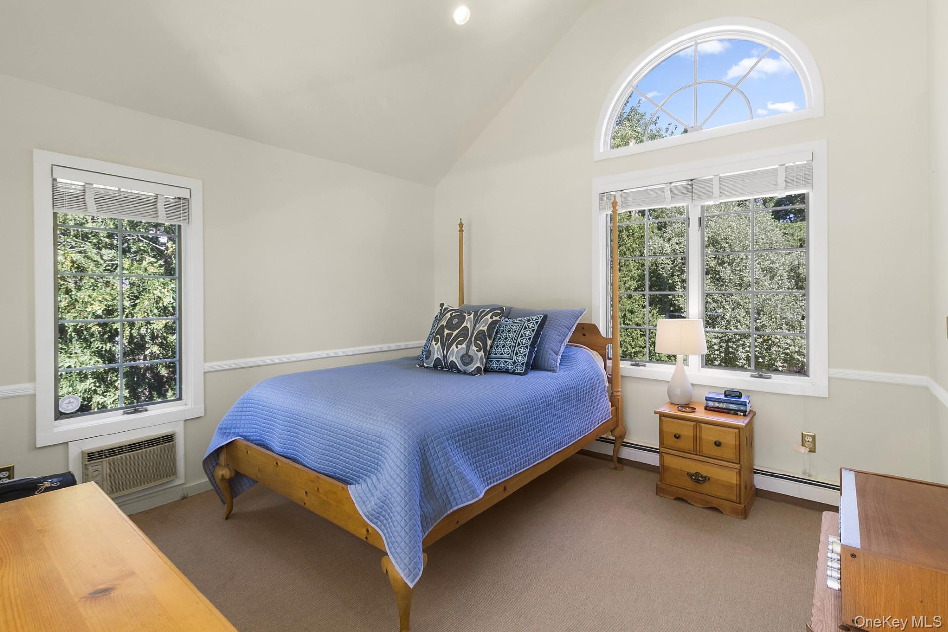 42 Towd Point Road Southampton, NY 11968 - Photo 12 of 26 a bedroom with a bed and a window