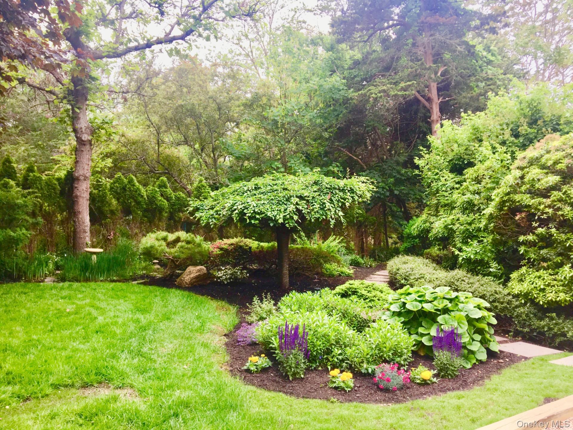 42 Towd Point Road Southampton, NY 11968 - Photo 18 of 26 a view of a garden with a flower garden