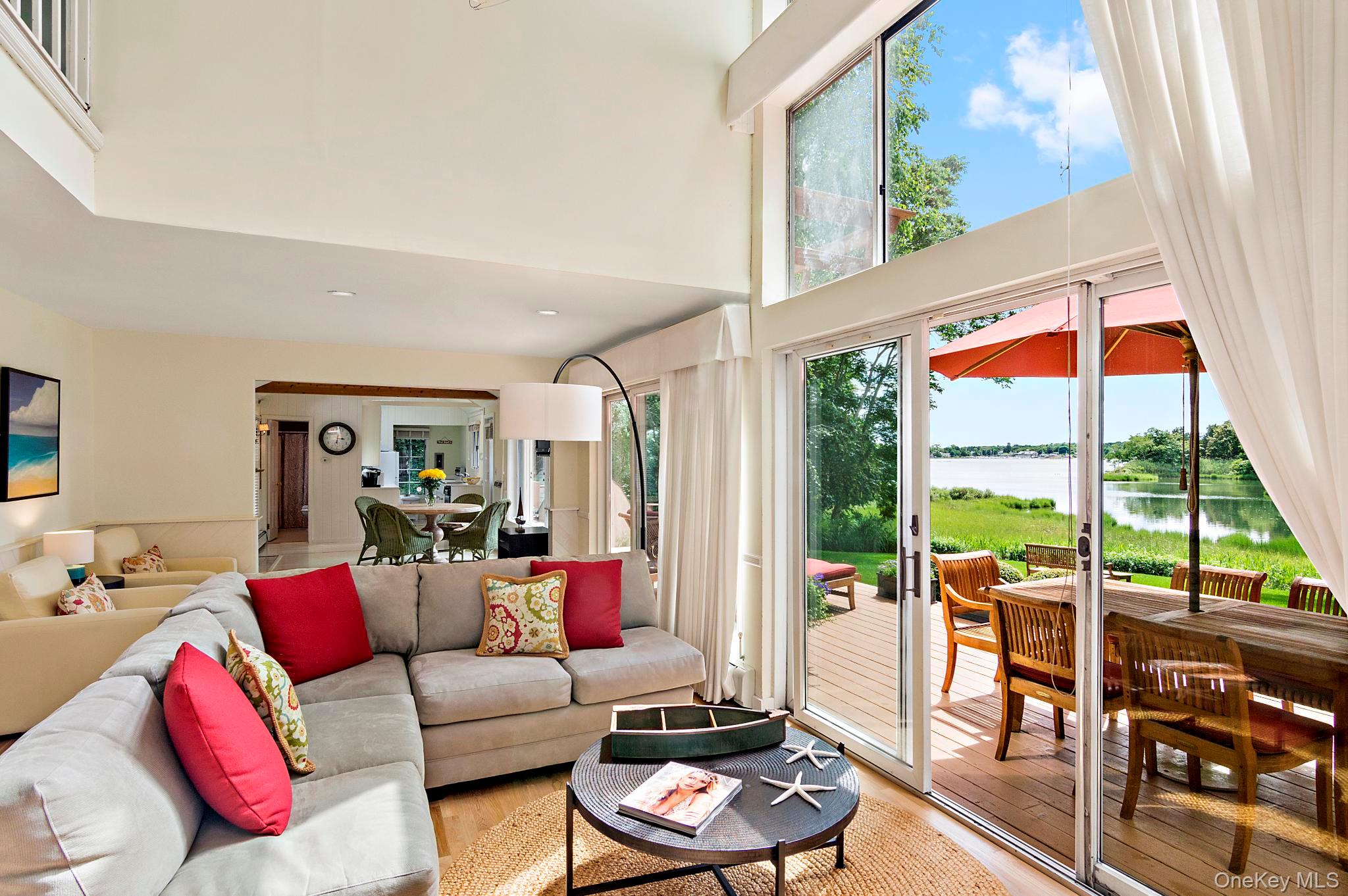 42 Towd Point Road Southampton, NY 11968 - Photo 7 of 26 a living room with furniture and a large window
