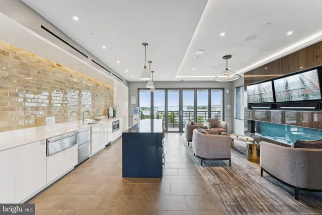 a large living room with furniture and a large window