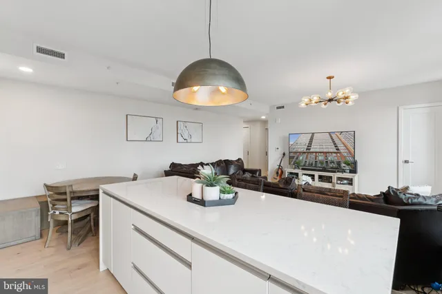a kitchen with a table and chairs