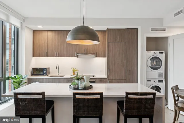 a kitchen with a table and chairs in it