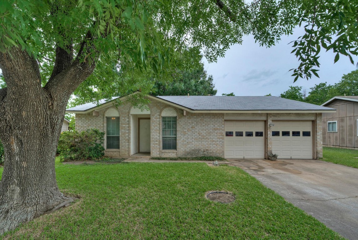 1815 Bradmore Drive Round Rock, TX 78664 - Photo 1 of 1 a view of a house with a yard and a large tree
