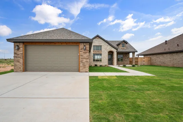 a front view of a house with yard