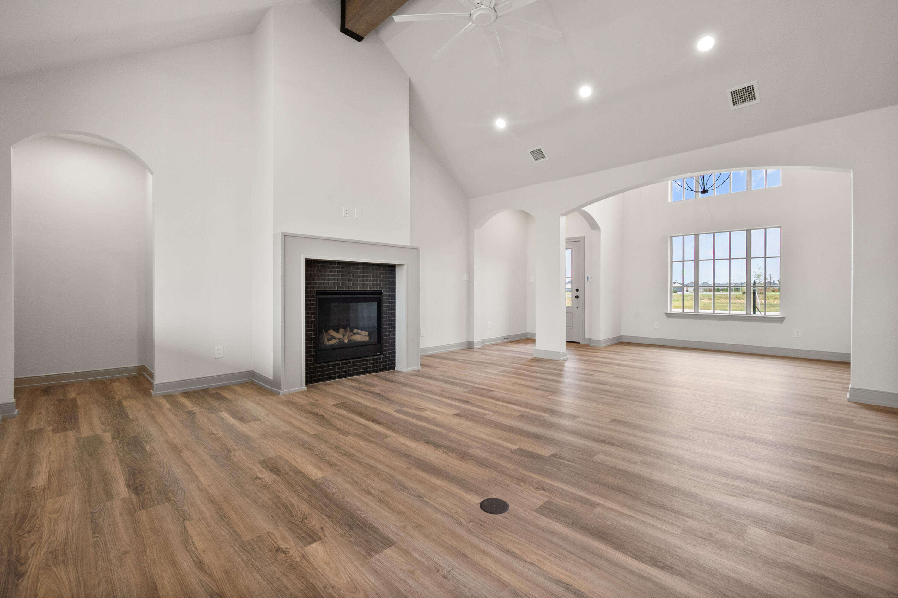 1005 North 5th Street Wolfforth, TX 79382 - Photo 13 of 36 an empty room with windows and fireplace