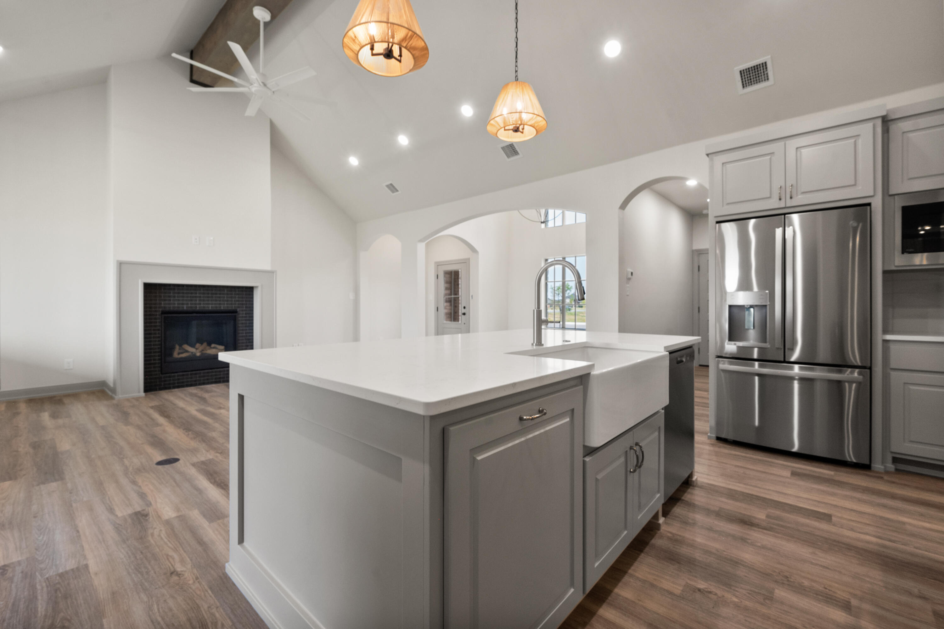 1005 North 5th Street Wolfforth, TX 79382 - Photo 19 of 36 a kitchen with a sink stainless steel appliances and cabinets