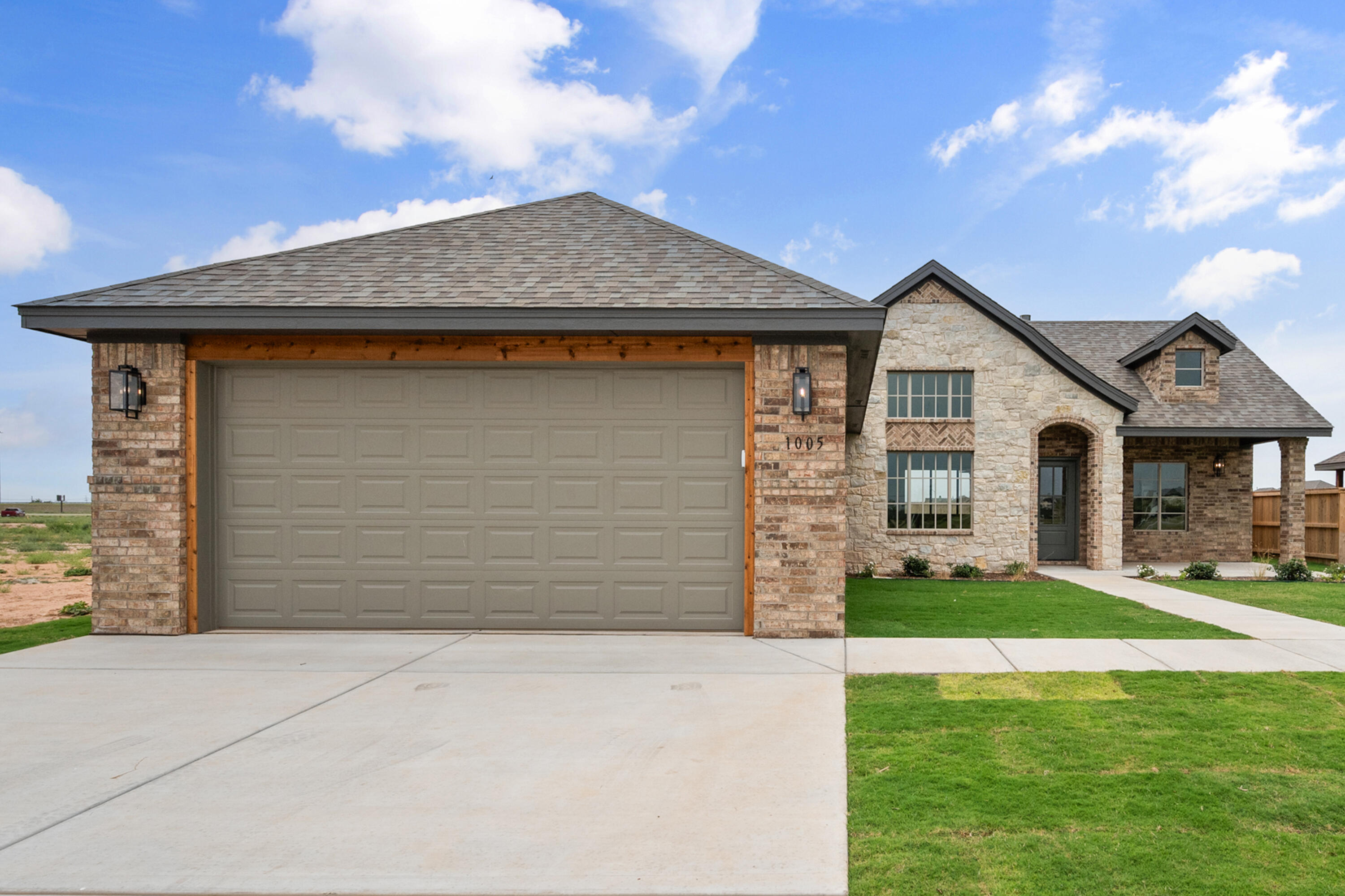 1005 North 5th Street Wolfforth, TX 79382 - Photo 2 of 36 a front view of a house with a yard