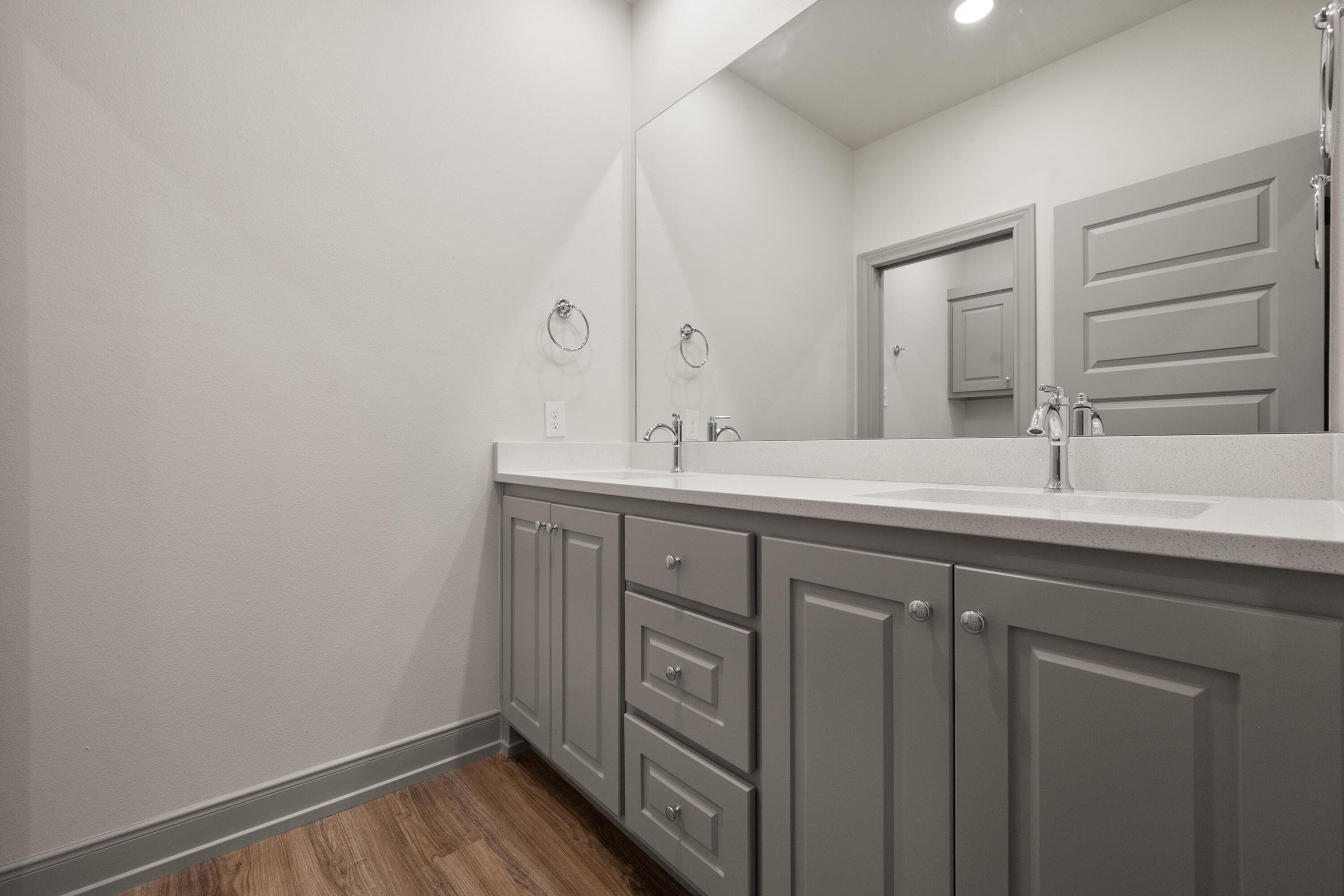 1005 North 5th Street Wolfforth, TX 79382 - Photo 23 of 36 a bathroom with a sink and a mirror