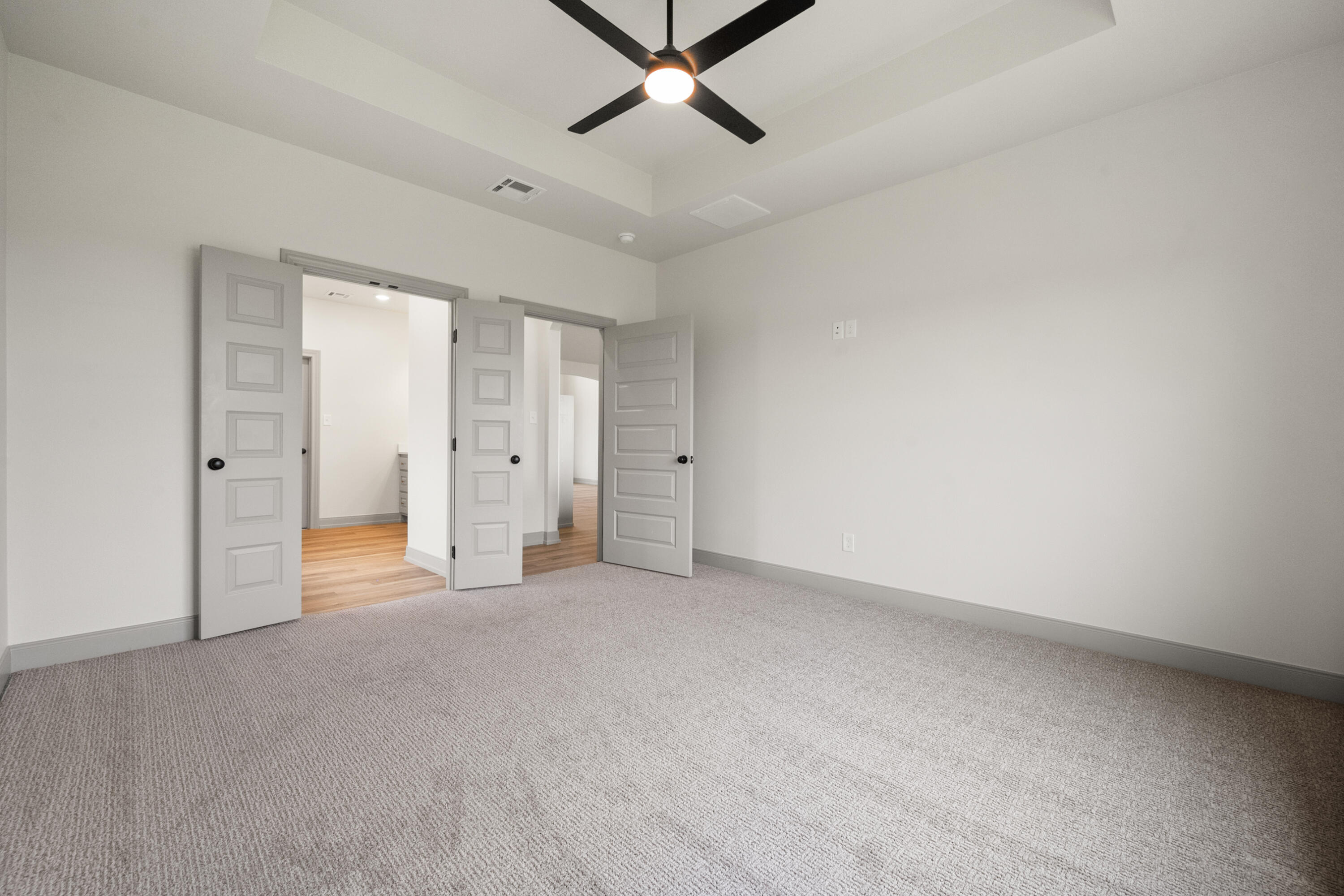 1005 North 5th Street Wolfforth, TX 79382 - Photo 27 of 36 an empty room with closet and a ceiling fan