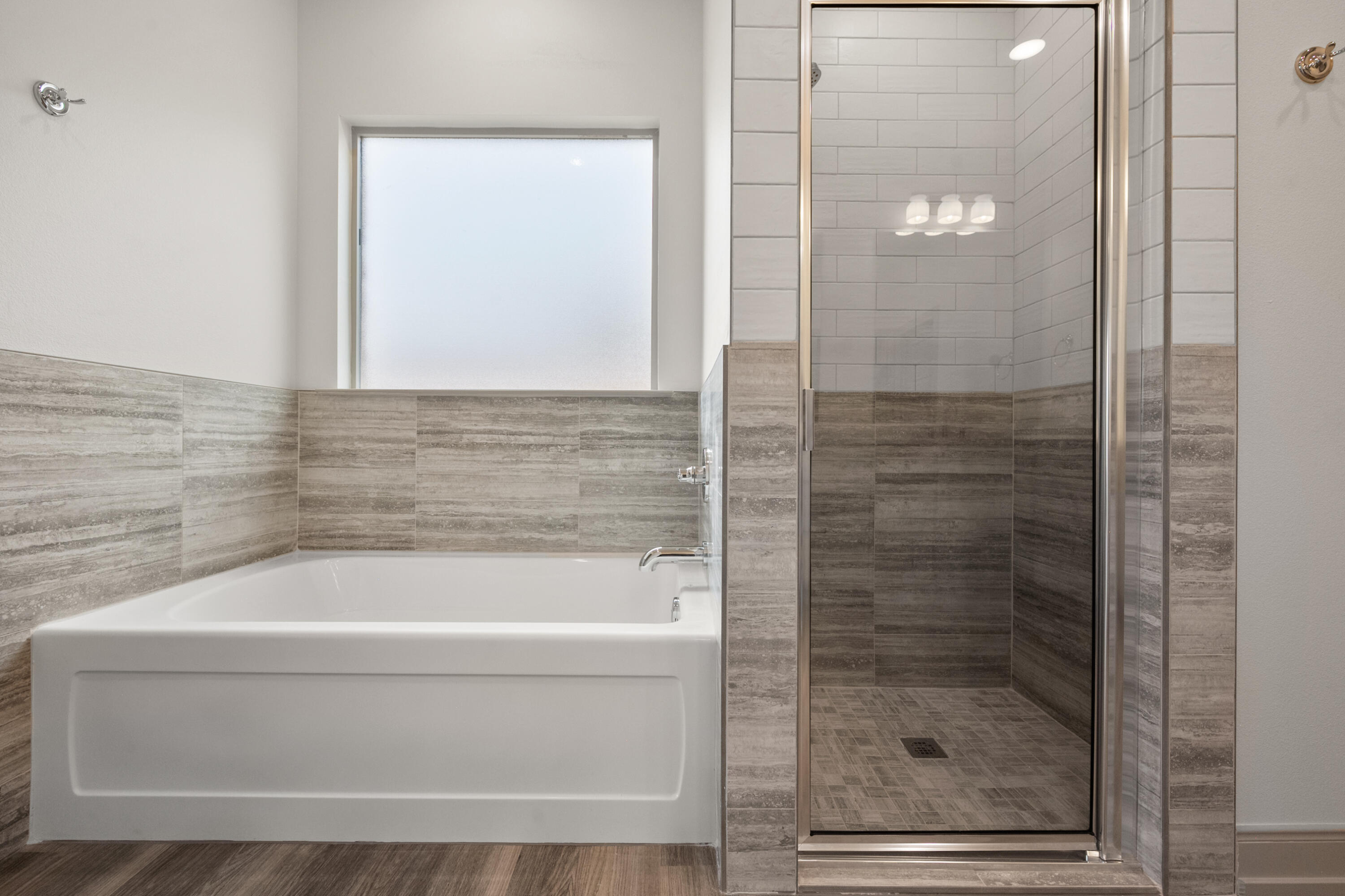 1005 North 5th Street Wolfforth, TX 79382 - Photo 30 of 36 a bathroom with a bathtub and shower