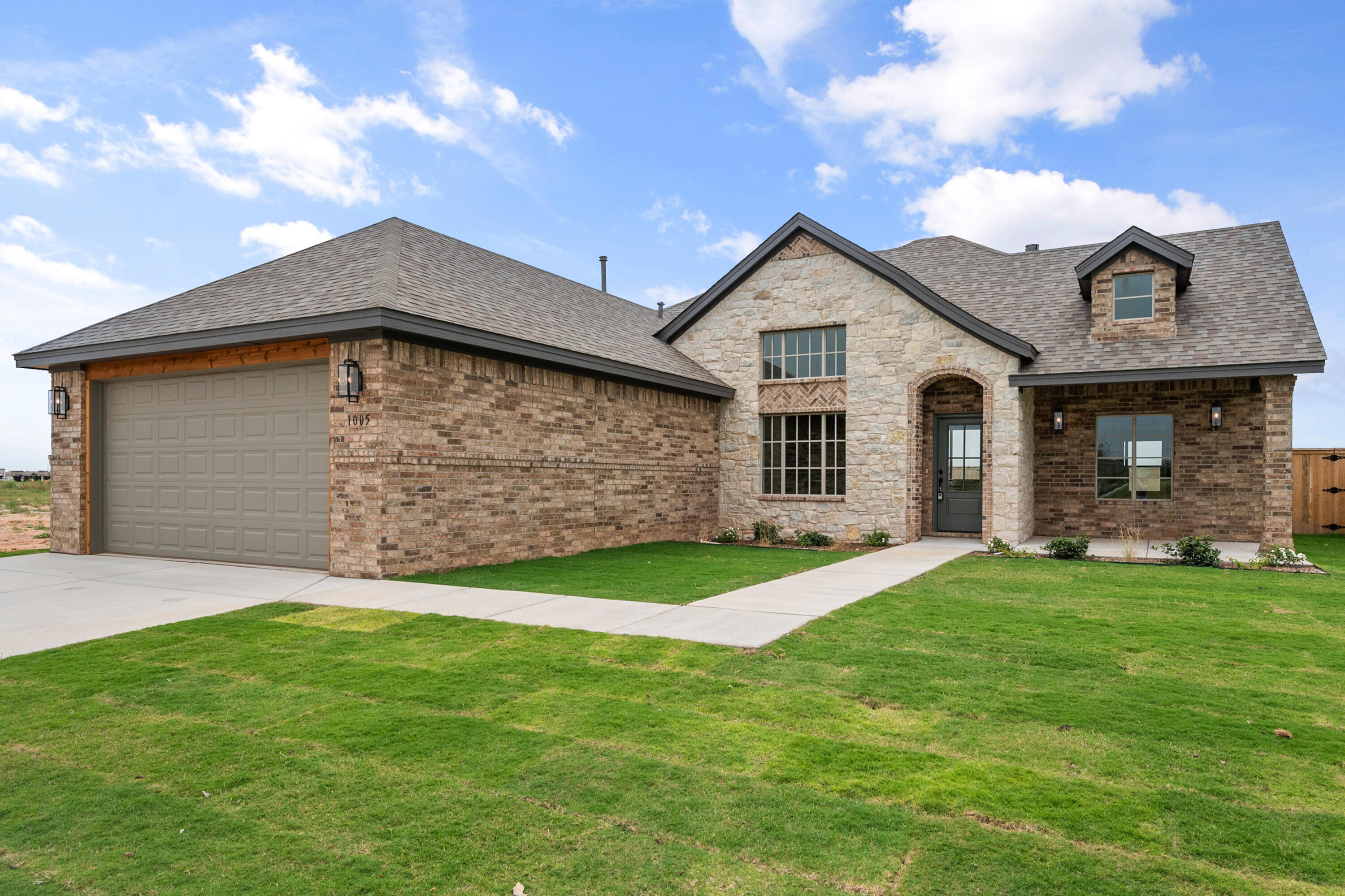 1005 North 5th Street Wolfforth, TX 79382 - Photo 3 of 36 a front view of a house with a yard