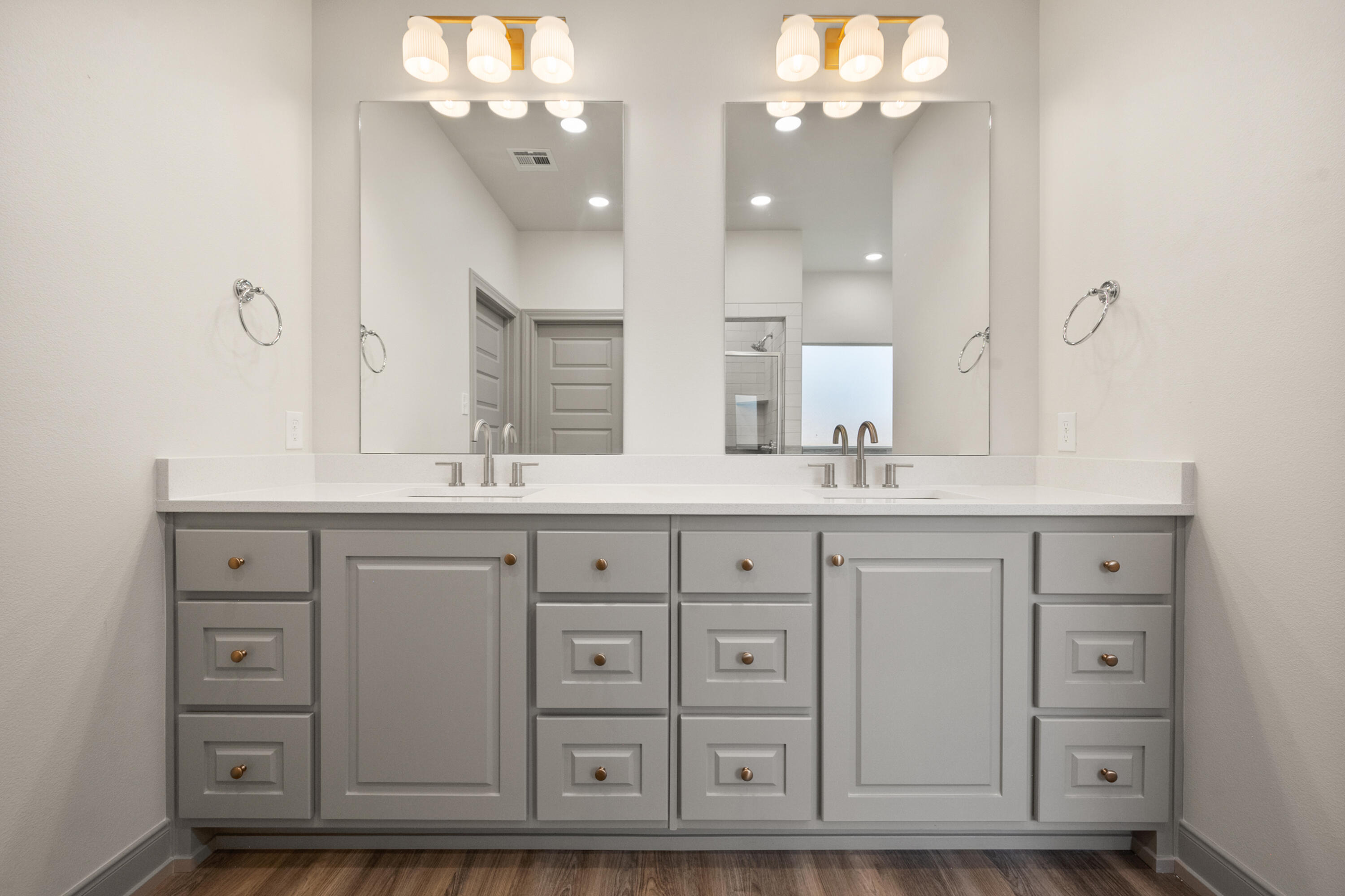 1005 North 5th Street Wolfforth, TX 79382 - Photo 31 of 36 a bathroom with a double vanity sink mirror and double