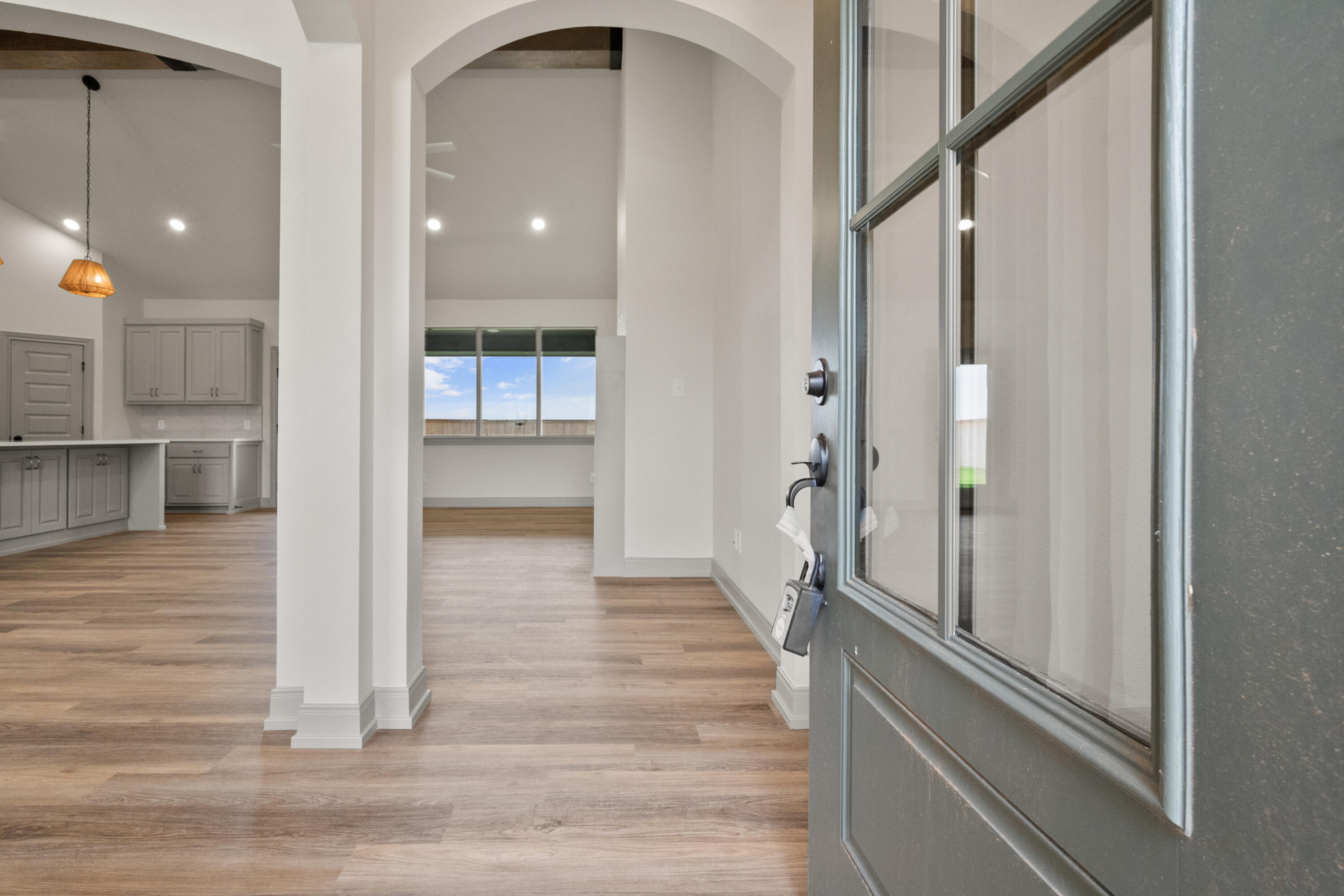 1005 North 5th Street Wolfforth, TX 79382 - Photo 5 of 36 a view of a hallway with wooden floor and staircase