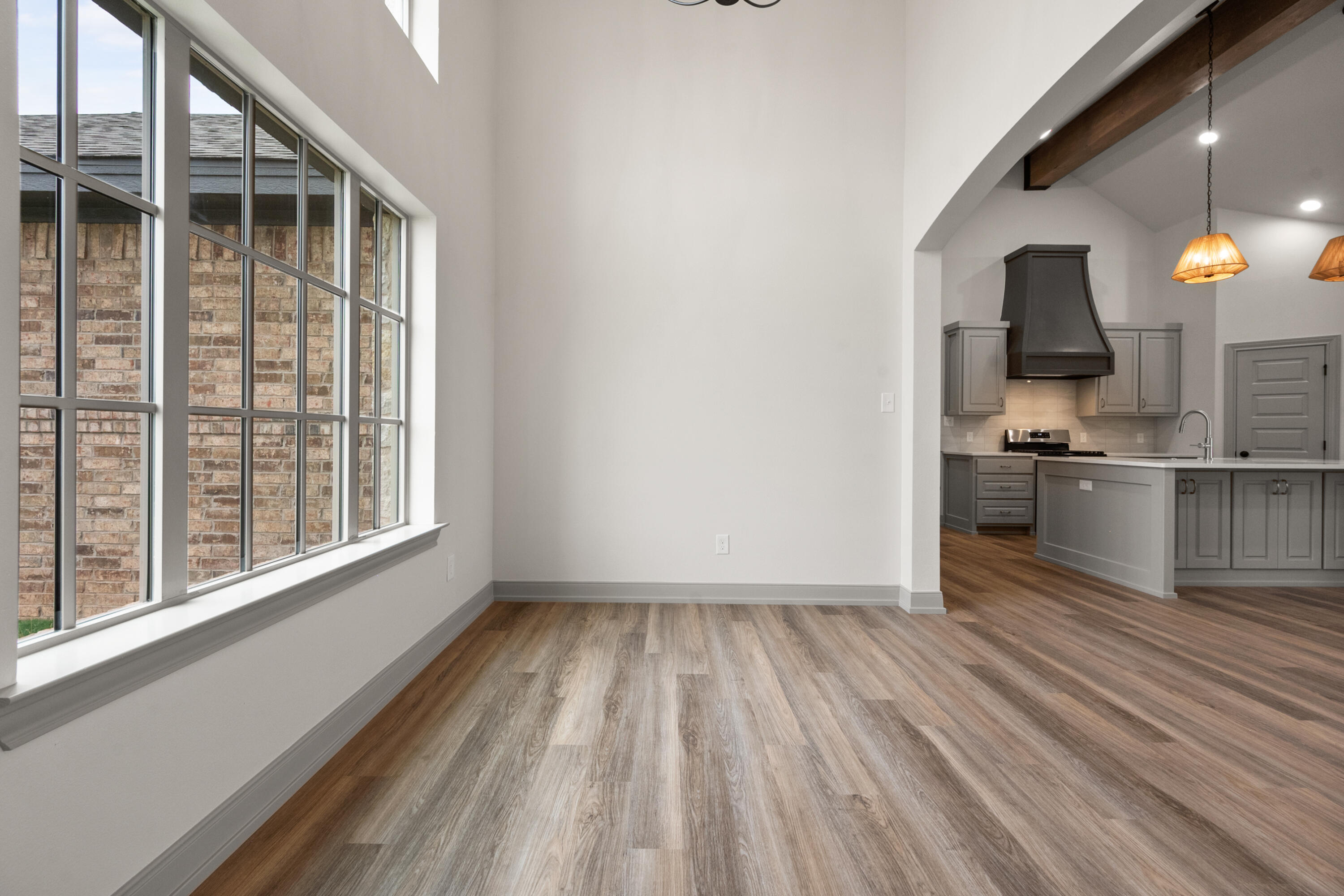 1005 North 5th Street Wolfforth, TX 79382 - Photo 9 of 36 a view of a kitchen from the hallway