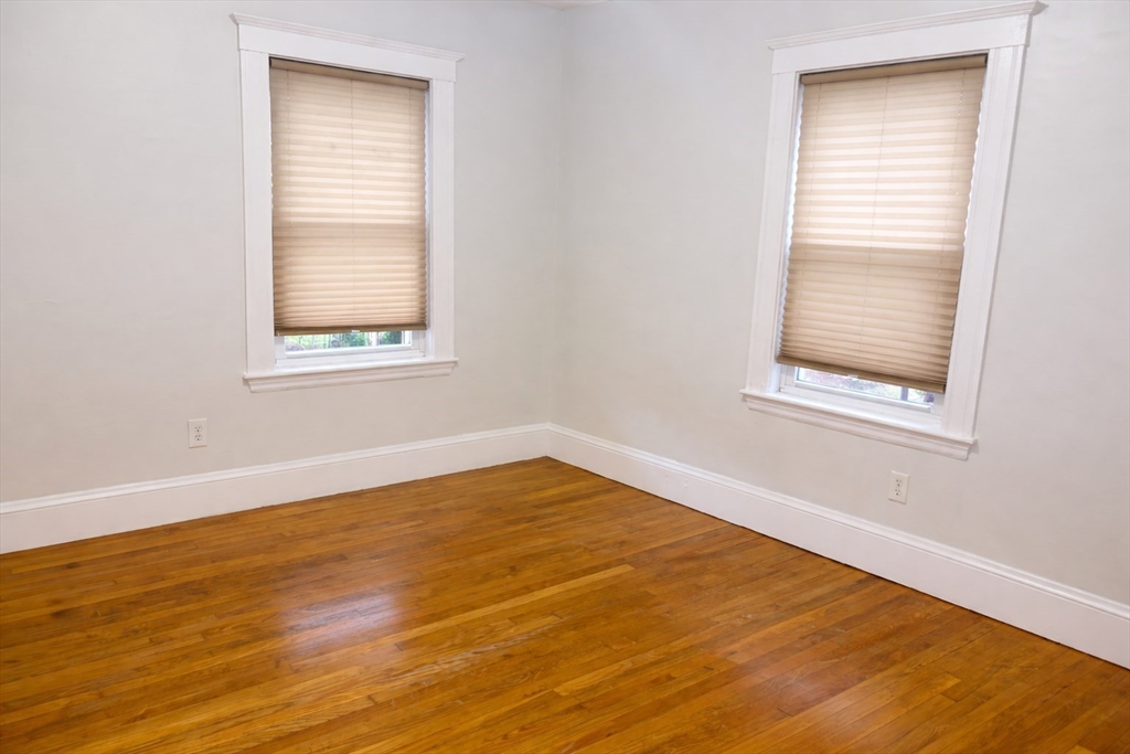 14 Walter Street, Unit 1 Boston, MA 02131 - Photo 11 of 14 an empty room with a window