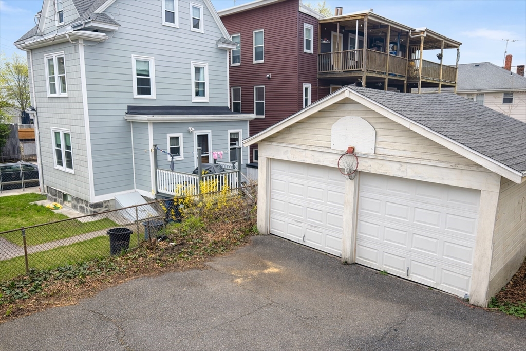 14 Walter Street, Unit 1 Boston, MA 02131 - Photo 14 of 14 a view of a house with a yard