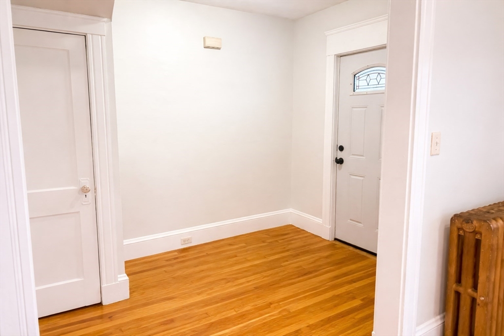14 Walter Street, Unit 1 Boston, MA 02131 - Photo 2 of 14 a view of a room that has a bed in it