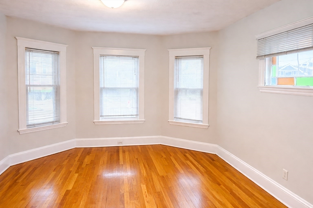 14 Walter Street, Unit 1 Boston, MA 02131 - Photo 3 of 14 a view of empty room with windows