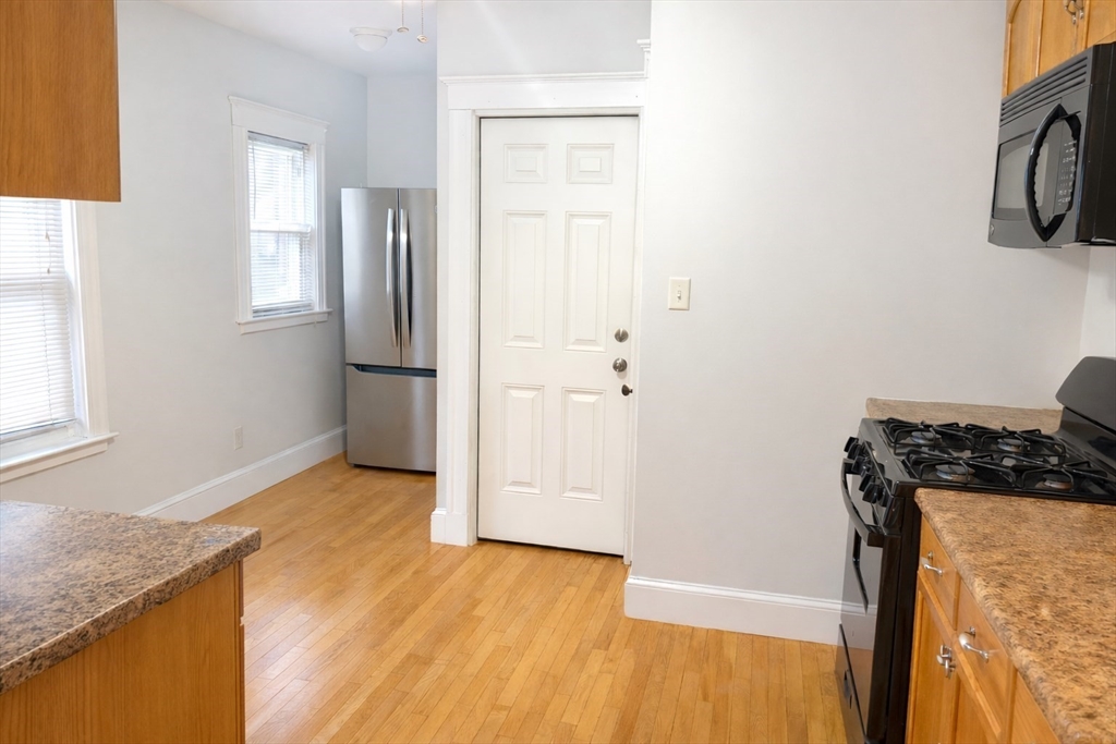 14 Walter Street, Unit 1 Boston, MA 02131 - Photo 6 of 14 a view of a storage and utility room with a window